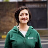 Photo of Doreen in a green Five Points Hoodie