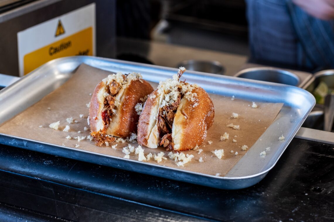 A photo of the Del Piero doughnut sliced in half on a tray